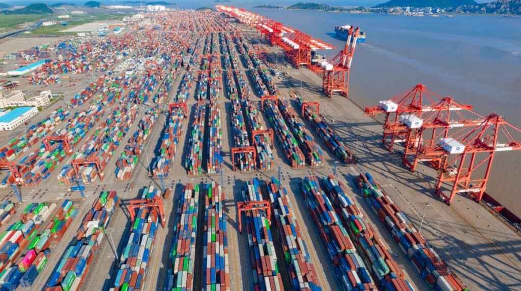 Aerial view of Shanghai port with shipping containers and cranes