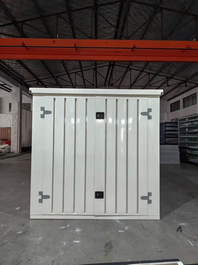 Front of a white 10ft pop-up container showing the double doors, hinges and two locking handles