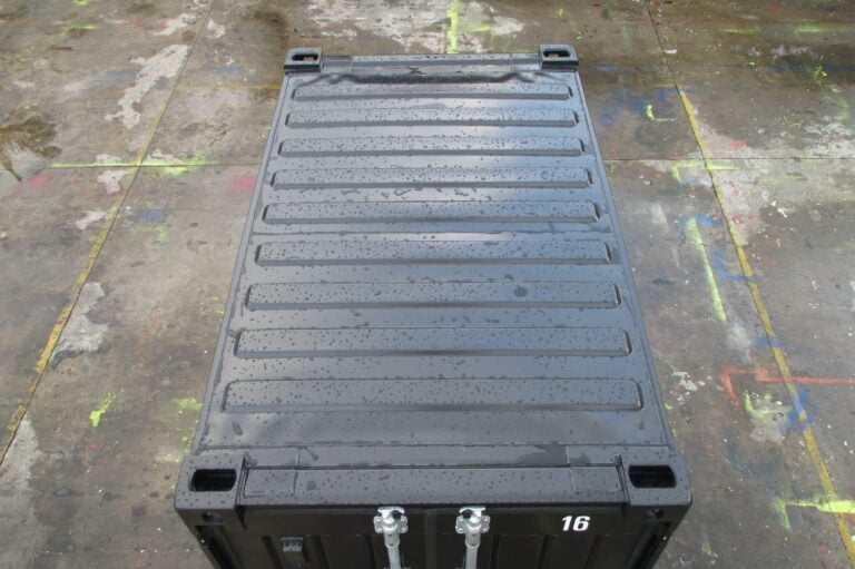 Top view of a black QuadCon container showing the roof and corner castings
